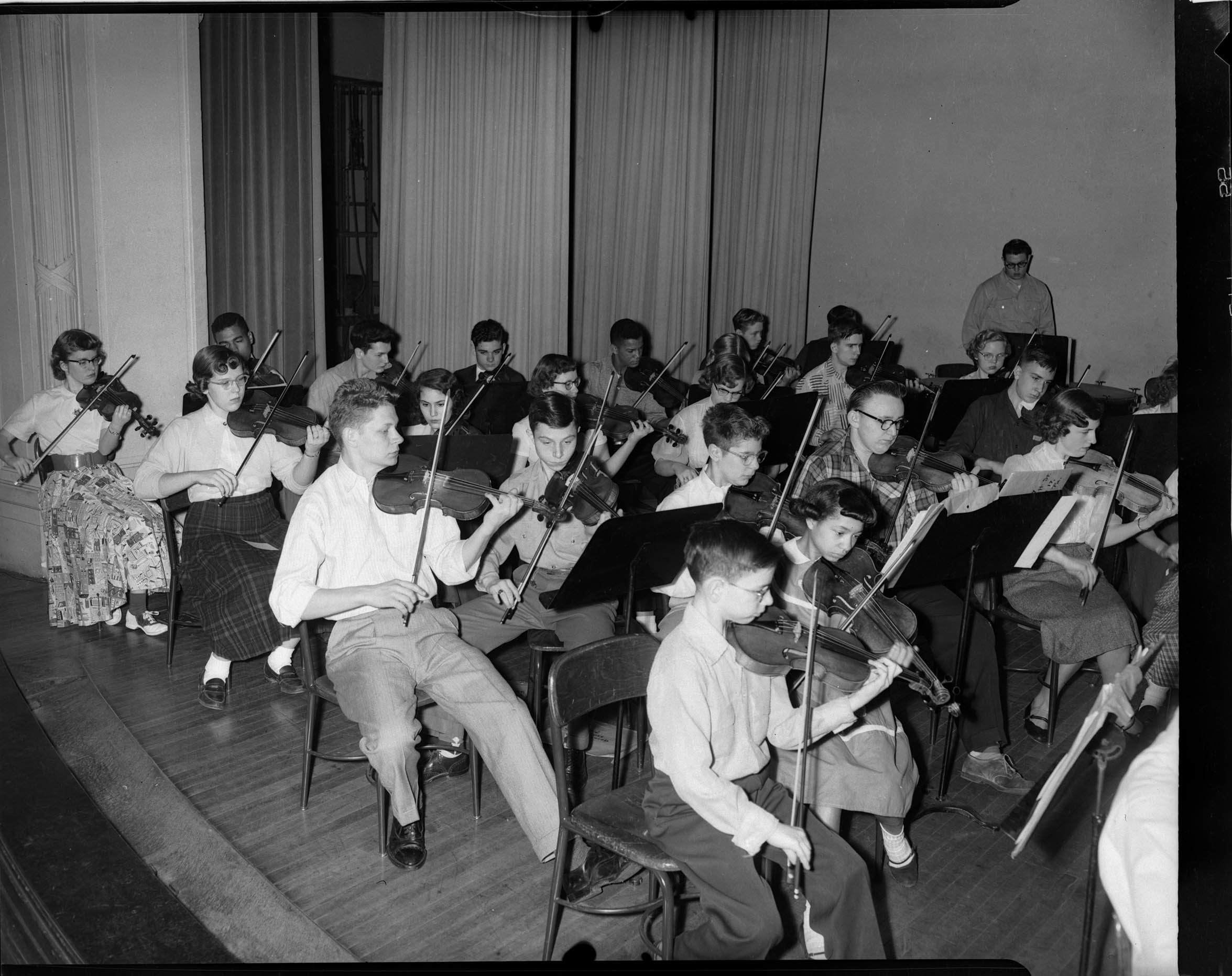 String section of Pittsburgh Symphony Junior Orchestra rehearsing in