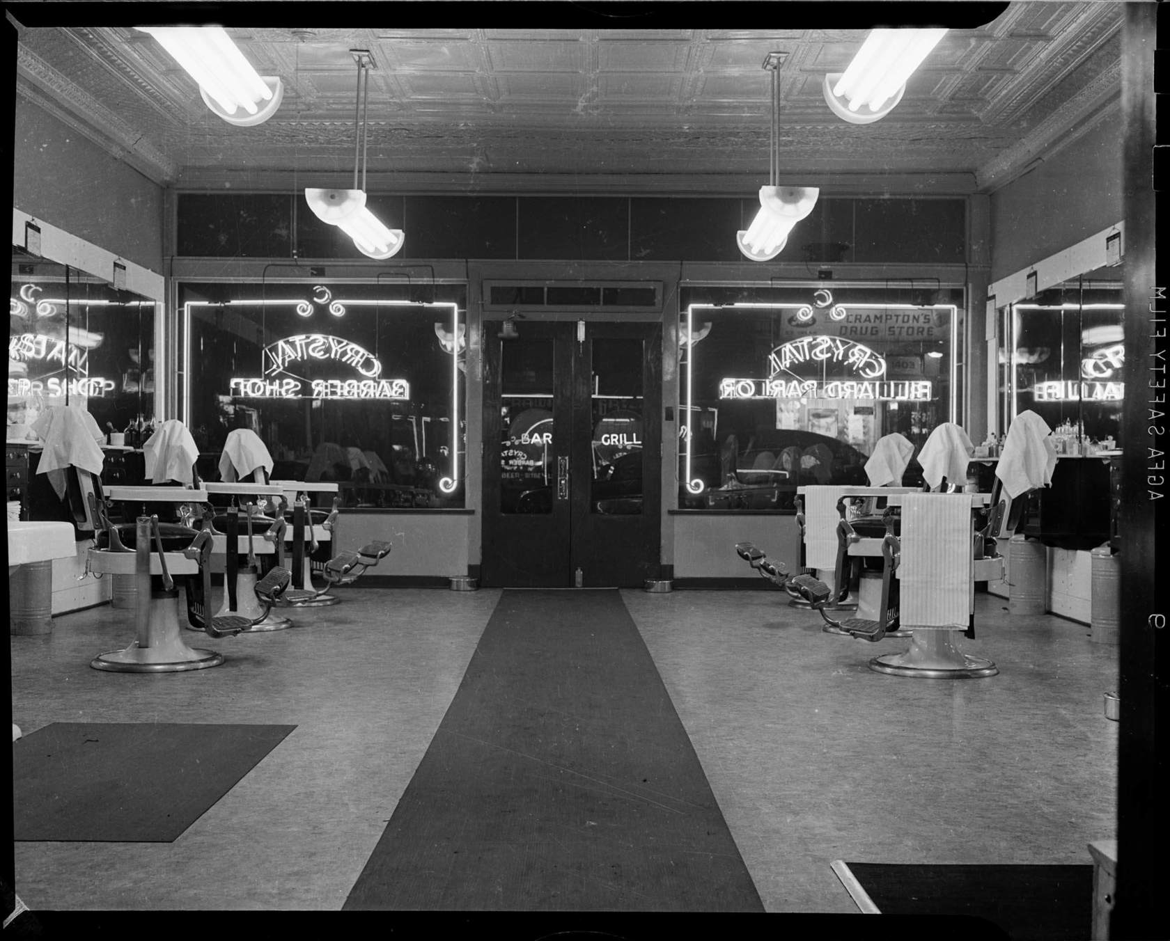 Interior of Crystal Barber Shop looking toward street, Wylie Avenue, Hill District CMOA Collection