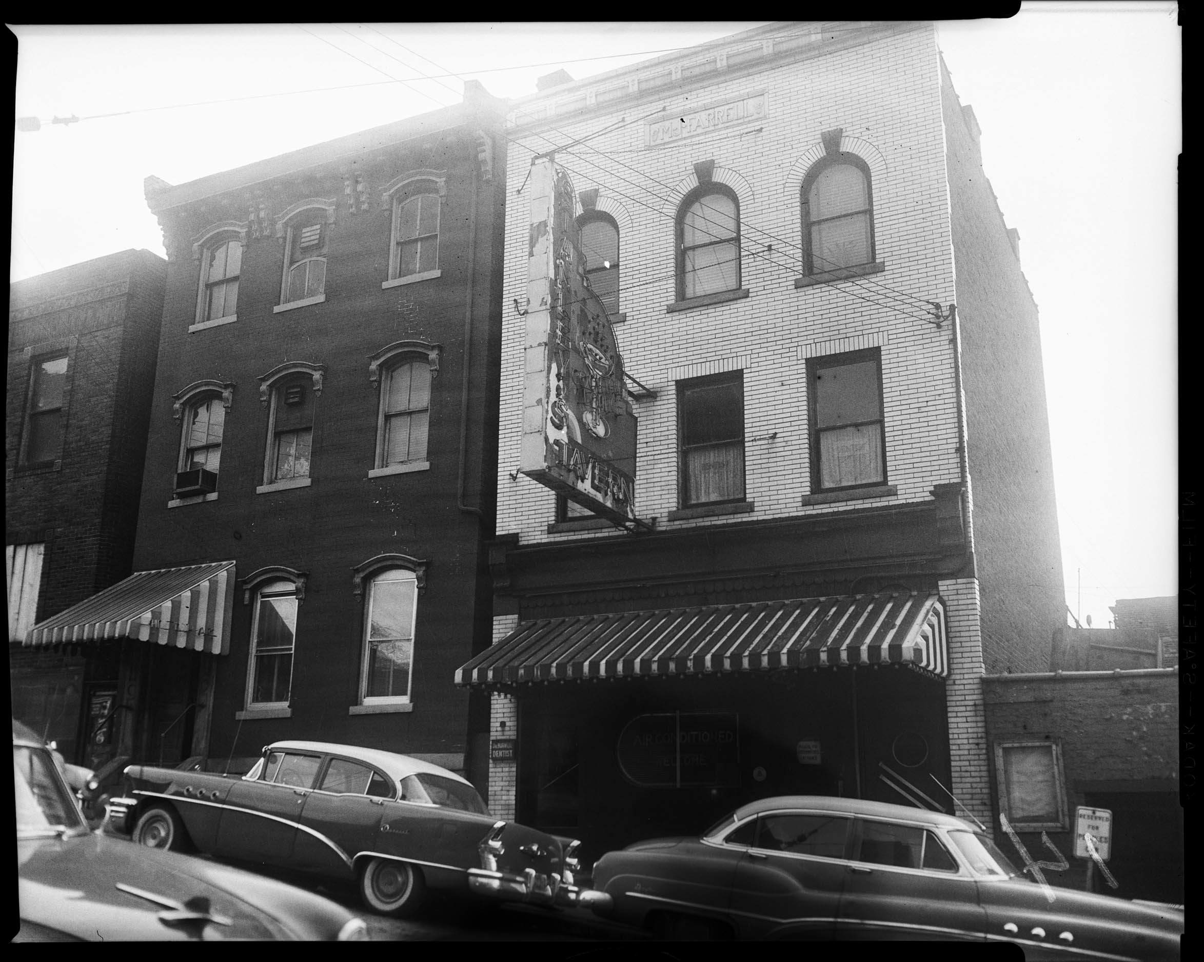 Exterior of Stanley’s Tavern with Dr. Burwell, Dentist, office next door, 1500 block of Wylie