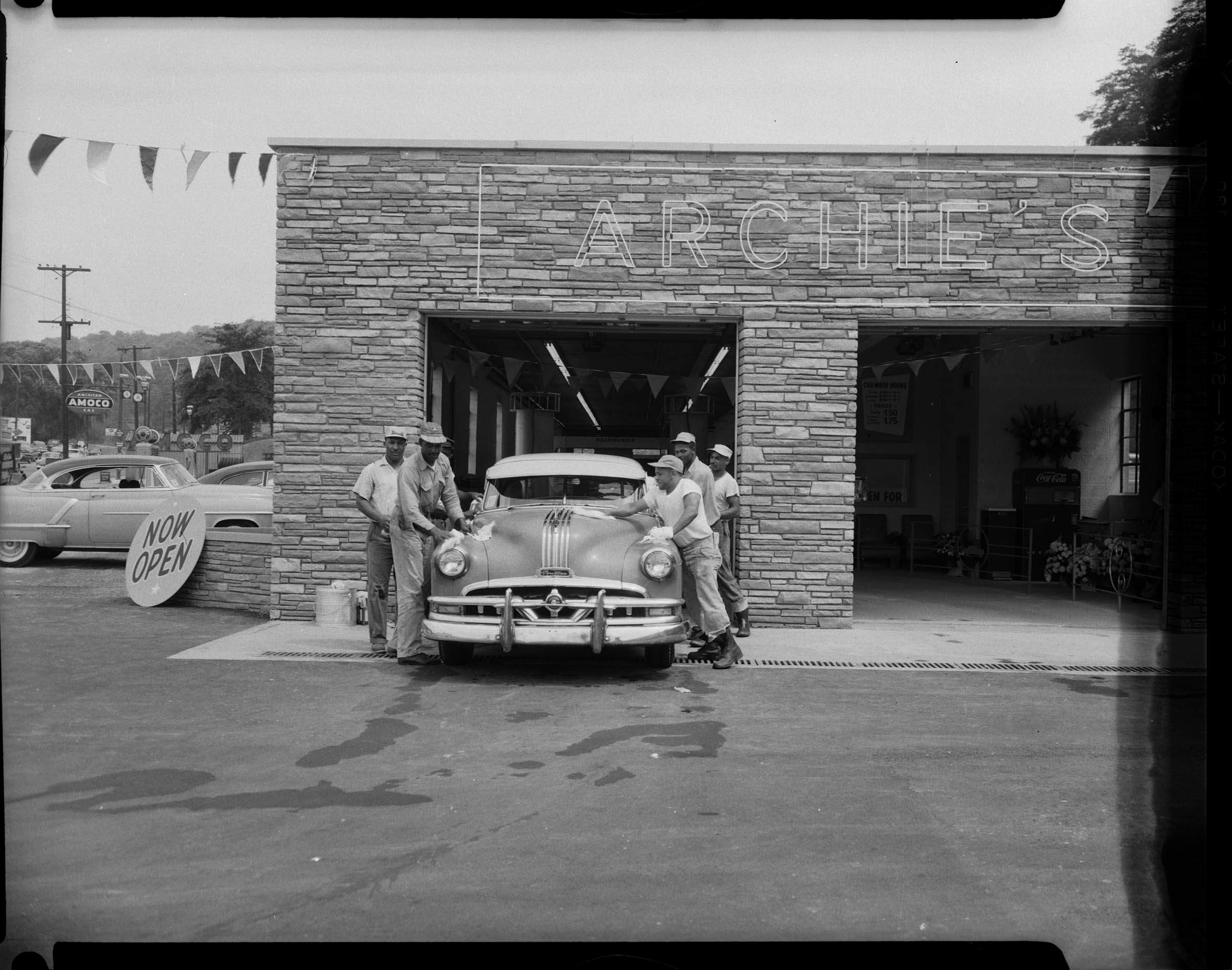 Archie’s Car Wash with men wiping down Pontiac emerging from Washmobile
