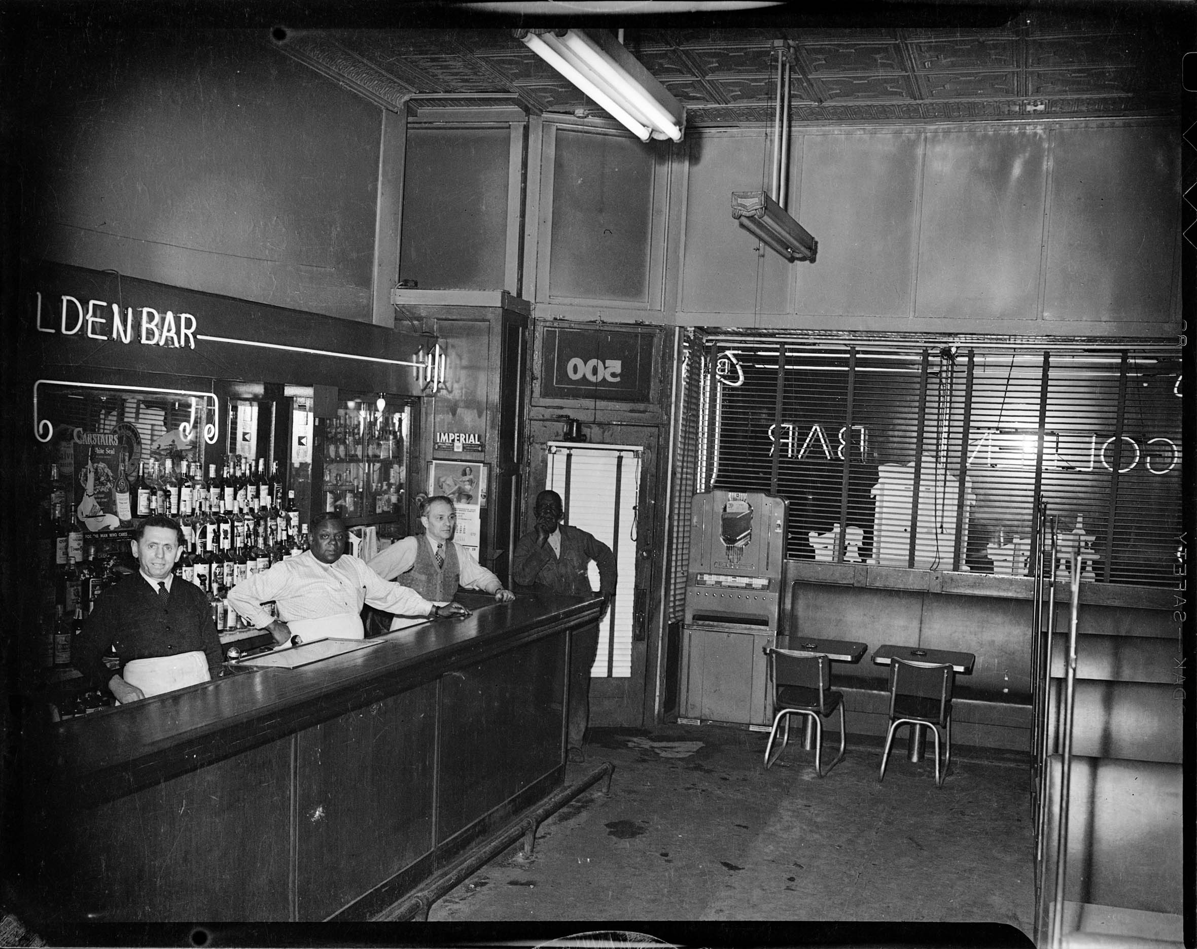 Interior Of Golden Bar With Tin Ceiling Neon Light Trim
