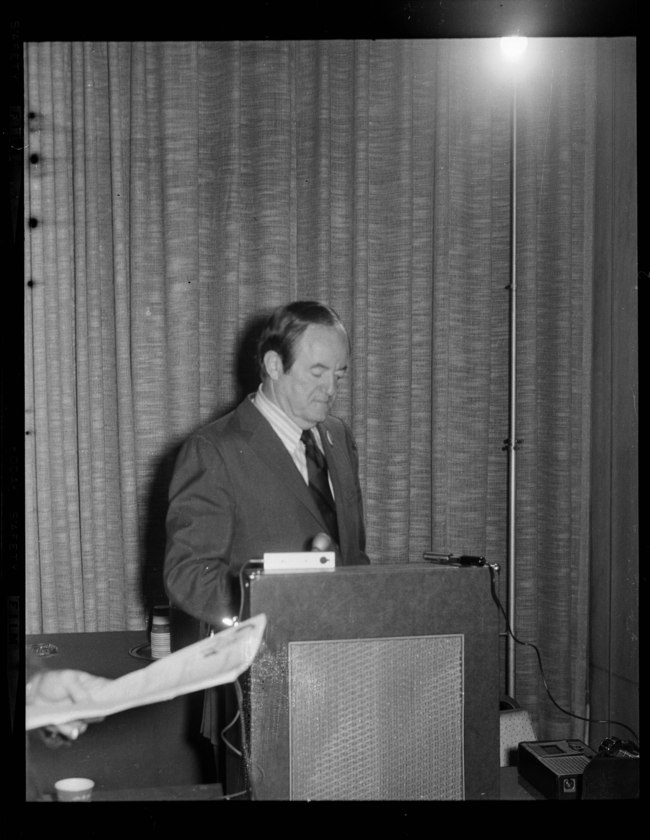 Hubert Humphrey wearing diagonally striped tie speaking at podium ... Hubert Humphrey