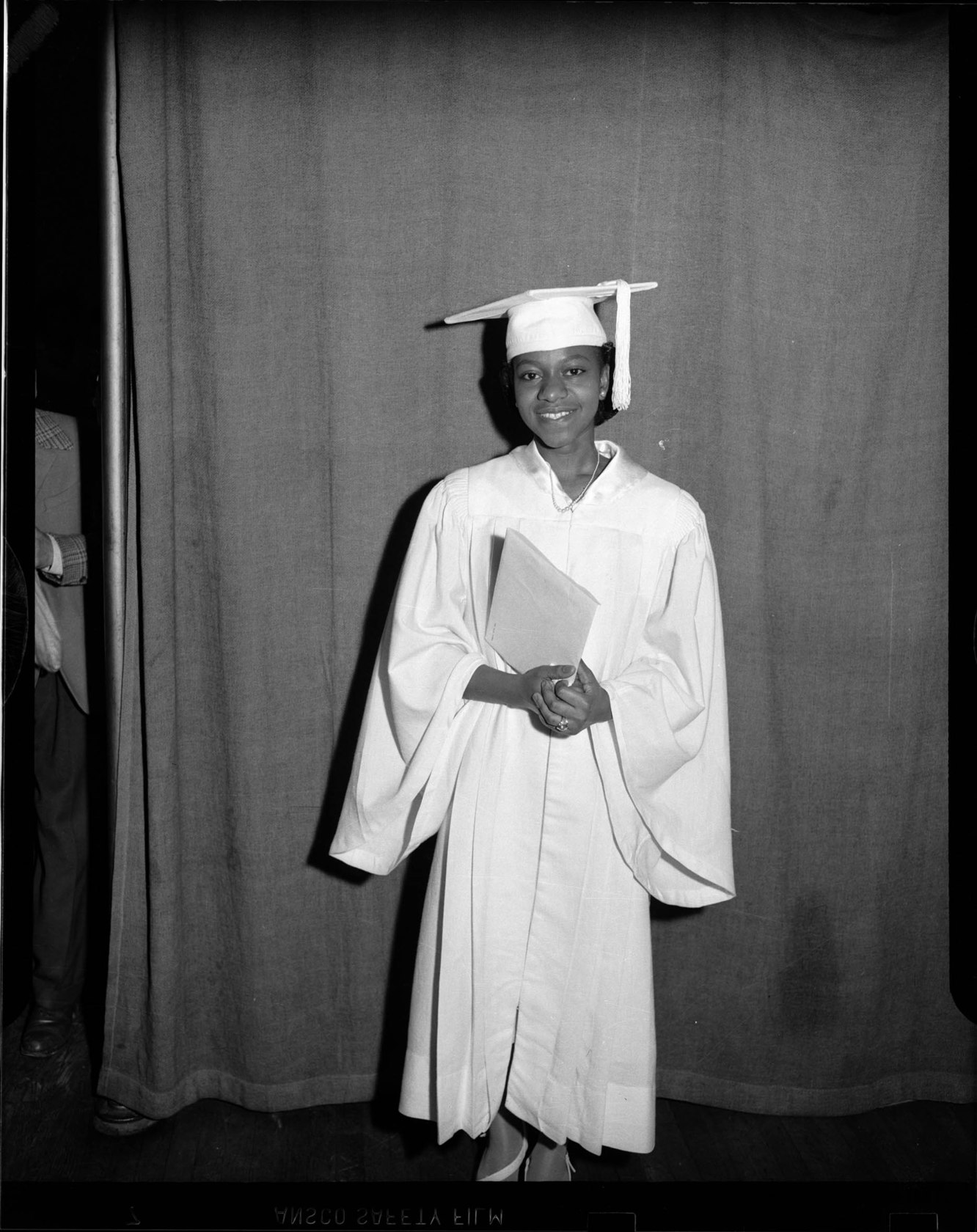Ethel Vaughn wearing light colored cap and gown at Fifth Avenue High
