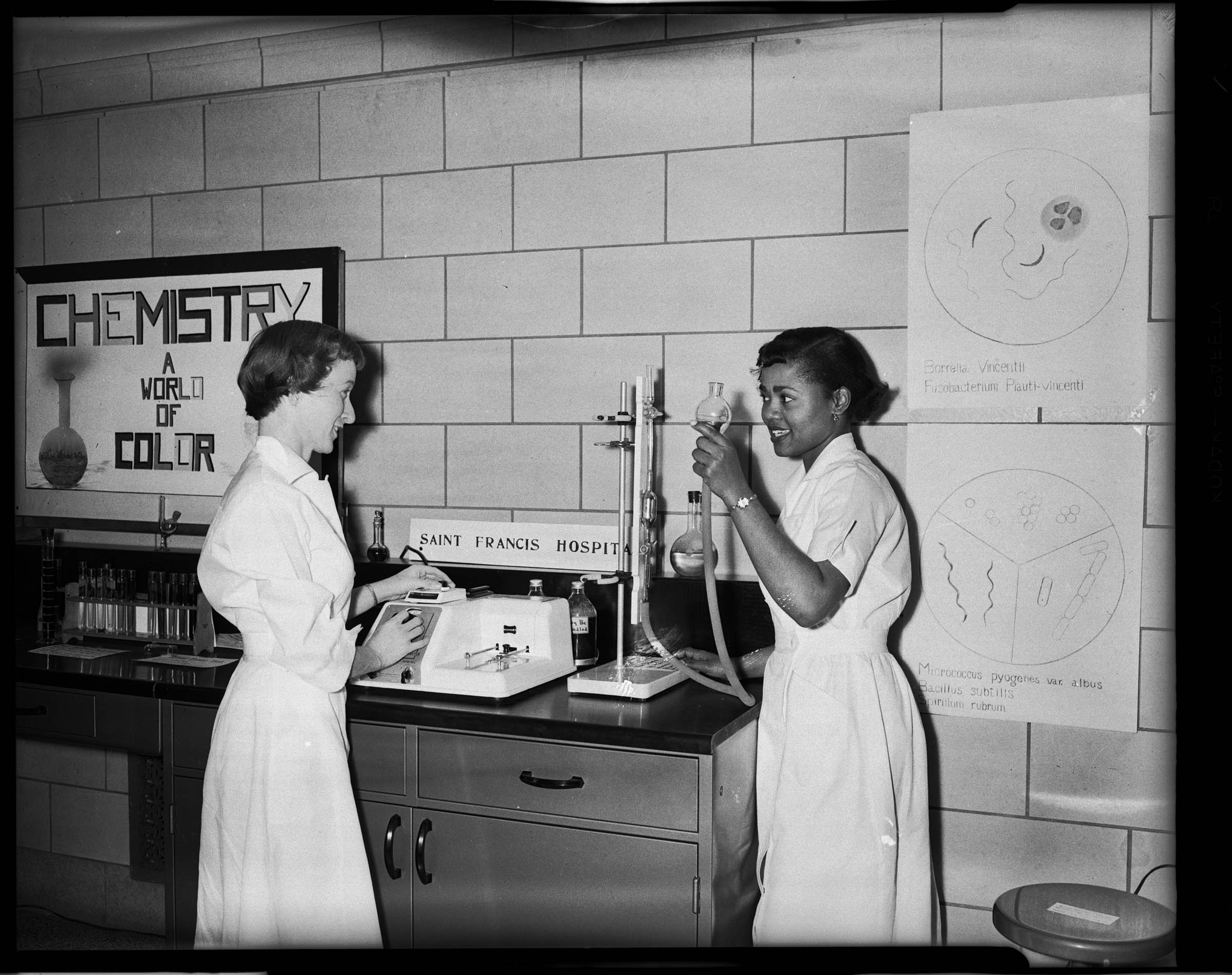 Catherine Schwan And Frances Barr Standing At An Exhibit For Medical 