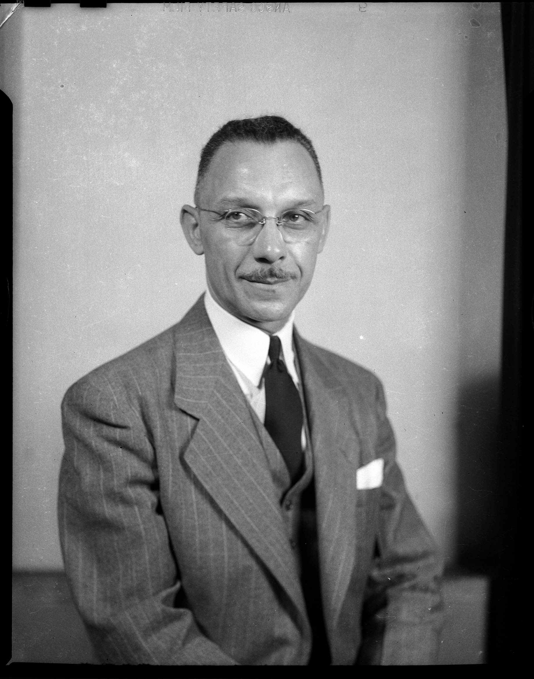 Portrait of attorney Richard F. Jones, wearing three piece pinstriped