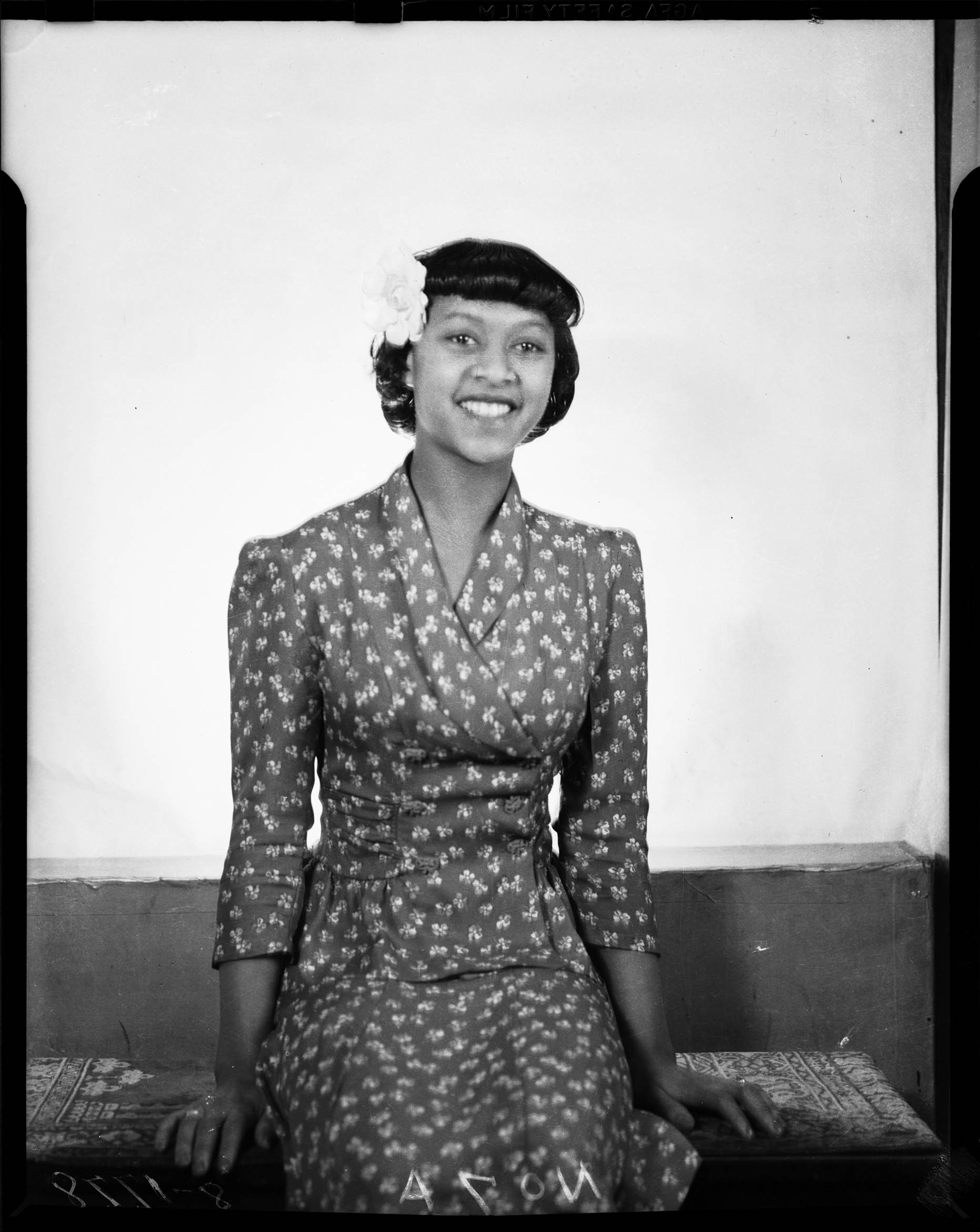 portrait-of-woman-possibly-doris-beal-wearing-dark-suit-with-flower