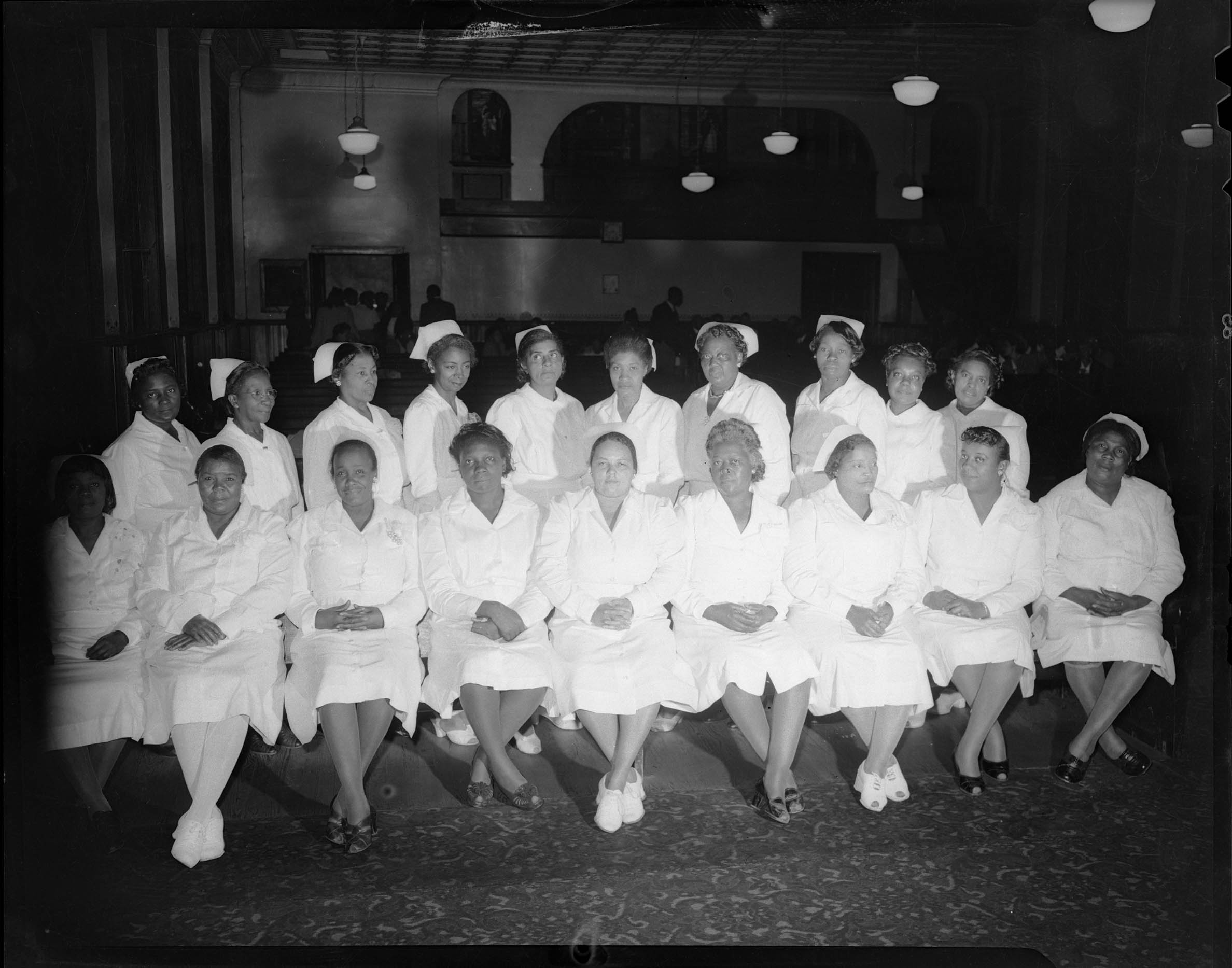 Group portrait of women wearing nursing uniforms, from Nurses