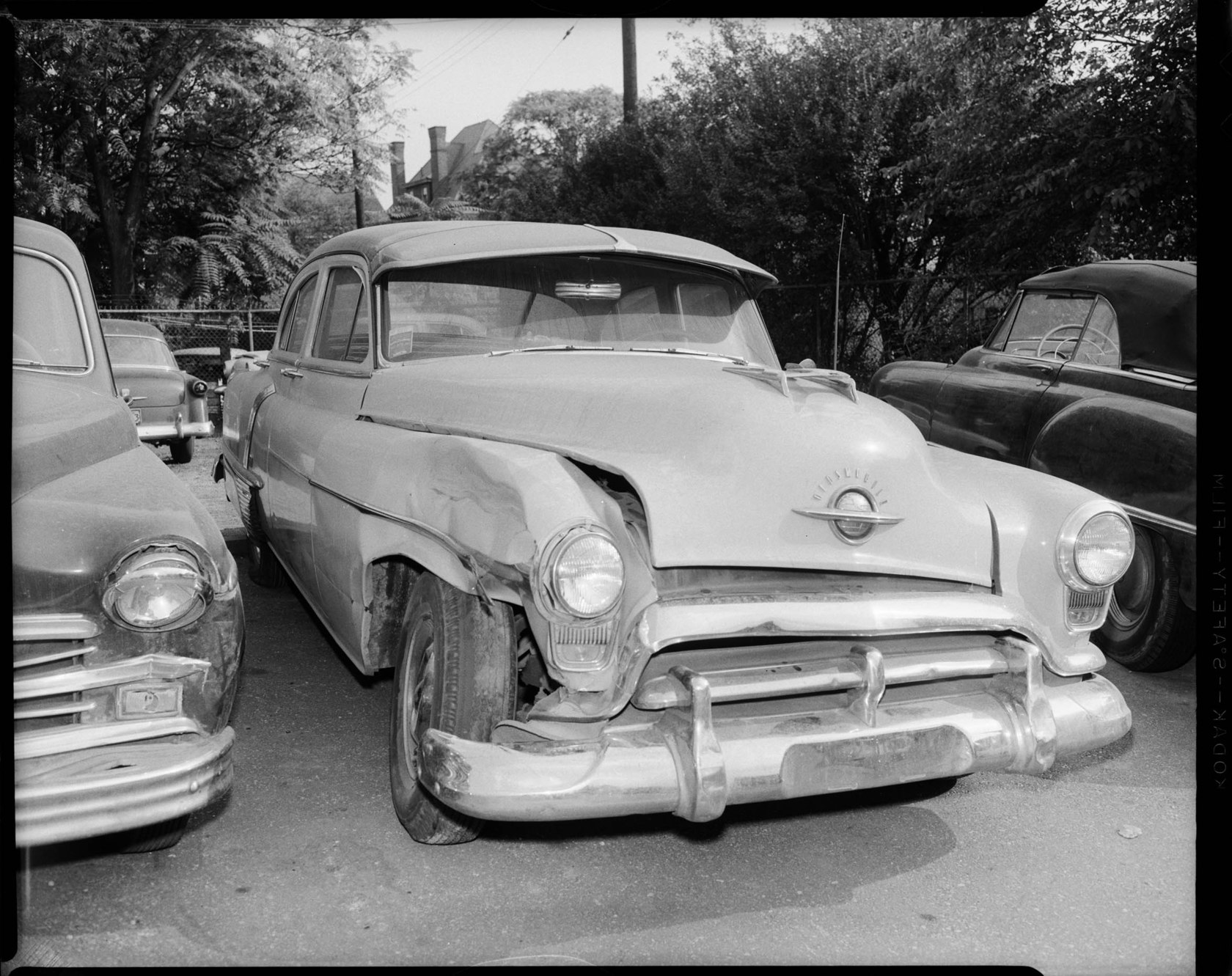 Oldsmobile car, possibly 1953 88 four door sedan, with